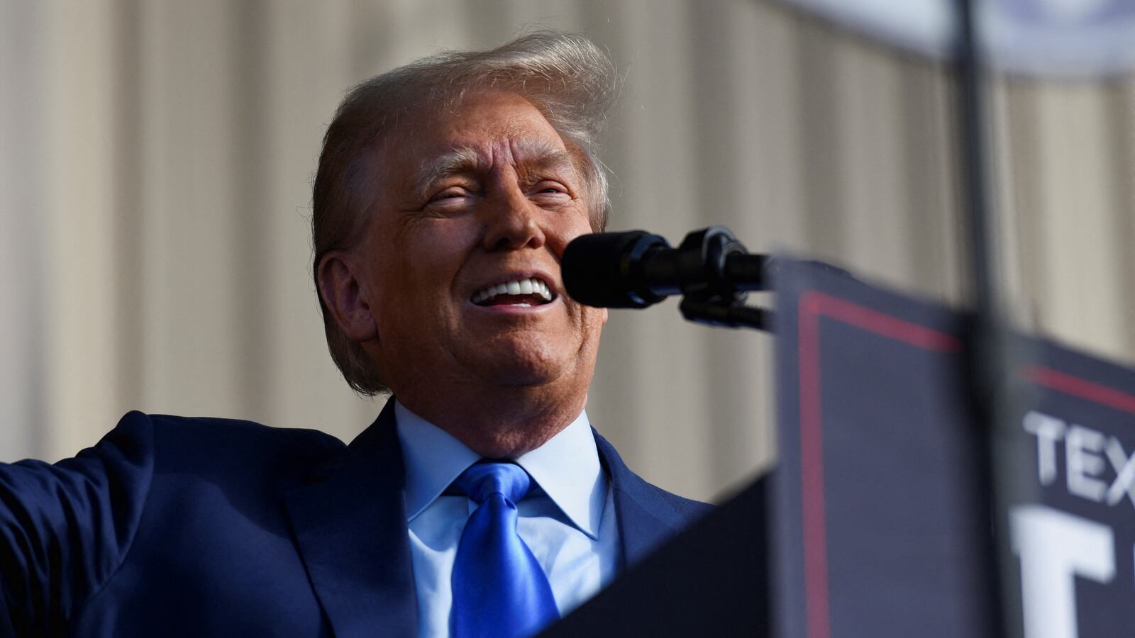 Republican presidential candidate and former U.S. President Donald Trump smiles at the crowd during a campaign rally in Houston, Texas