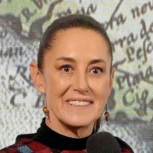 Mexico's President Claudia Sheinbaum with a map of "Mexican America" in the background.