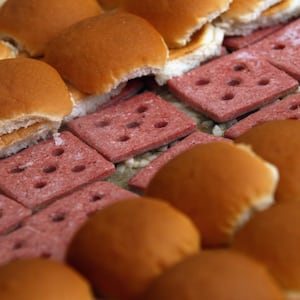 WASHINGTON, DC - JUNE 14: White Castle employees cook their slider burgers before delivering them at the U.S. Capitol to celebrate the company's 90th anniversary with a "Castles at the Capitol" event June 14, 2011 in Washington, DC. Representatives of the Columbus, Ohio-based company hand-delivered their slider burgers to waiting congressional employees during their lunch hour. (Photo by Win McNamee/Getty Images)