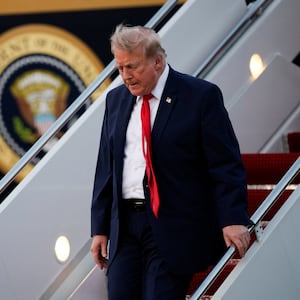 U.S. President Donald Trump deboards the plane as he arrives at Joint Base Andrews in Maryland, U.S., July 19, 2026.