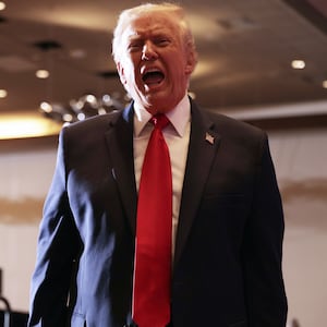 U.S. President Donald Trump departs from the stage after delivering remarks during an event at Mount Airy Casino Resort on December 9, 2025 in Mount Pocono, Pennsylvania.