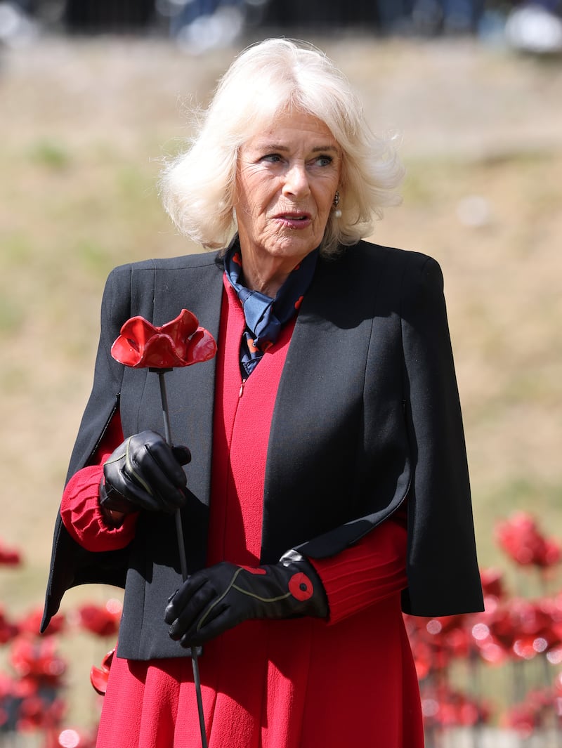 Queen Camilla visits the new display of ceramic poppies, called The Tower Remembers, at the Tower of London on May 06, 2025