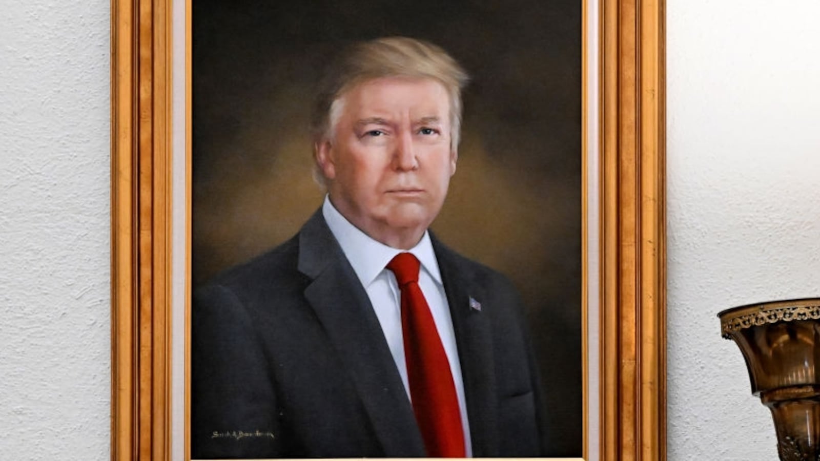 DENVER, CO - MARCH 24: A visitor takes a picture of the portrait of president Donald Trump, right, that hang on walls in the rotunda on the third floor of the Colorado State Capitol in Denver, Colorado on March 24, 2025. The portraits of Presidents Barack Obama, left, and Donald Trump were painted by Sarah A. Boardman. Boardman painted Trump's portrait in 2019. (Photo by Helen H. Richardson/MediaNews Group/The Denver Post via Getty Images)