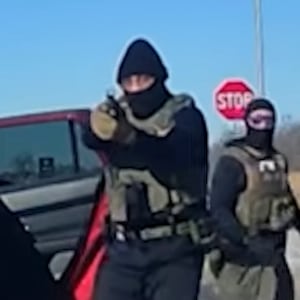 ICE agents stop an unarmed woman in St. Peter, Minnesota.
