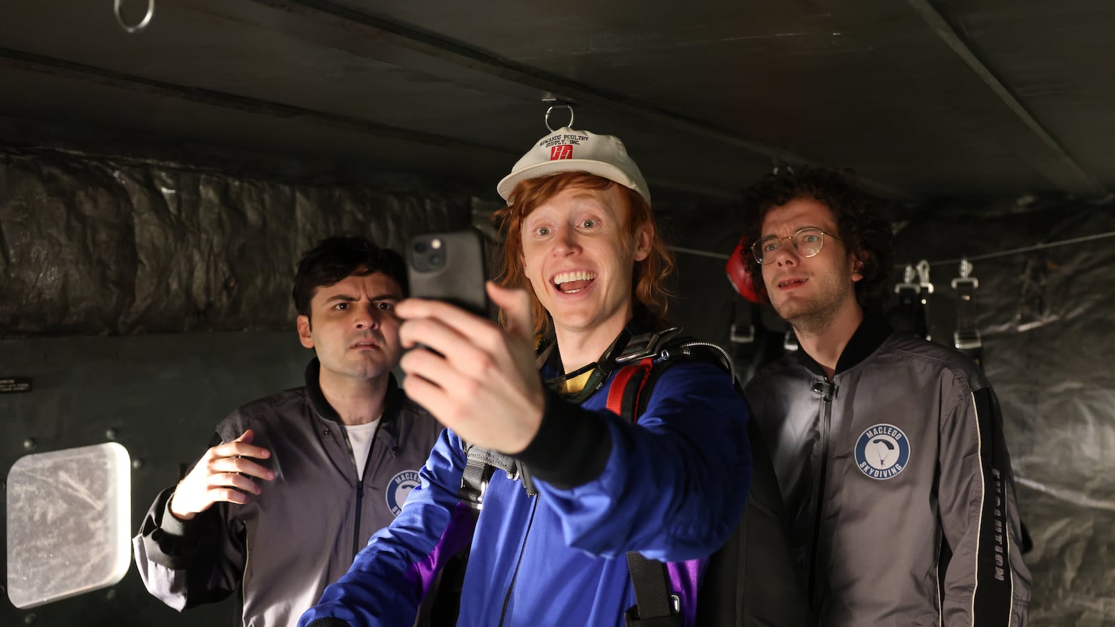 SATURDAY NIGHT LIVE -- Episode 1868 -- Pictured: (l-r) John Higgins, Ben Marshall, and Martin Herlihy during the "Skydiving" sketch on Saturday, October 19, 2024 -- (Photo by: Holland Rainwater/NBC via Getty Images)