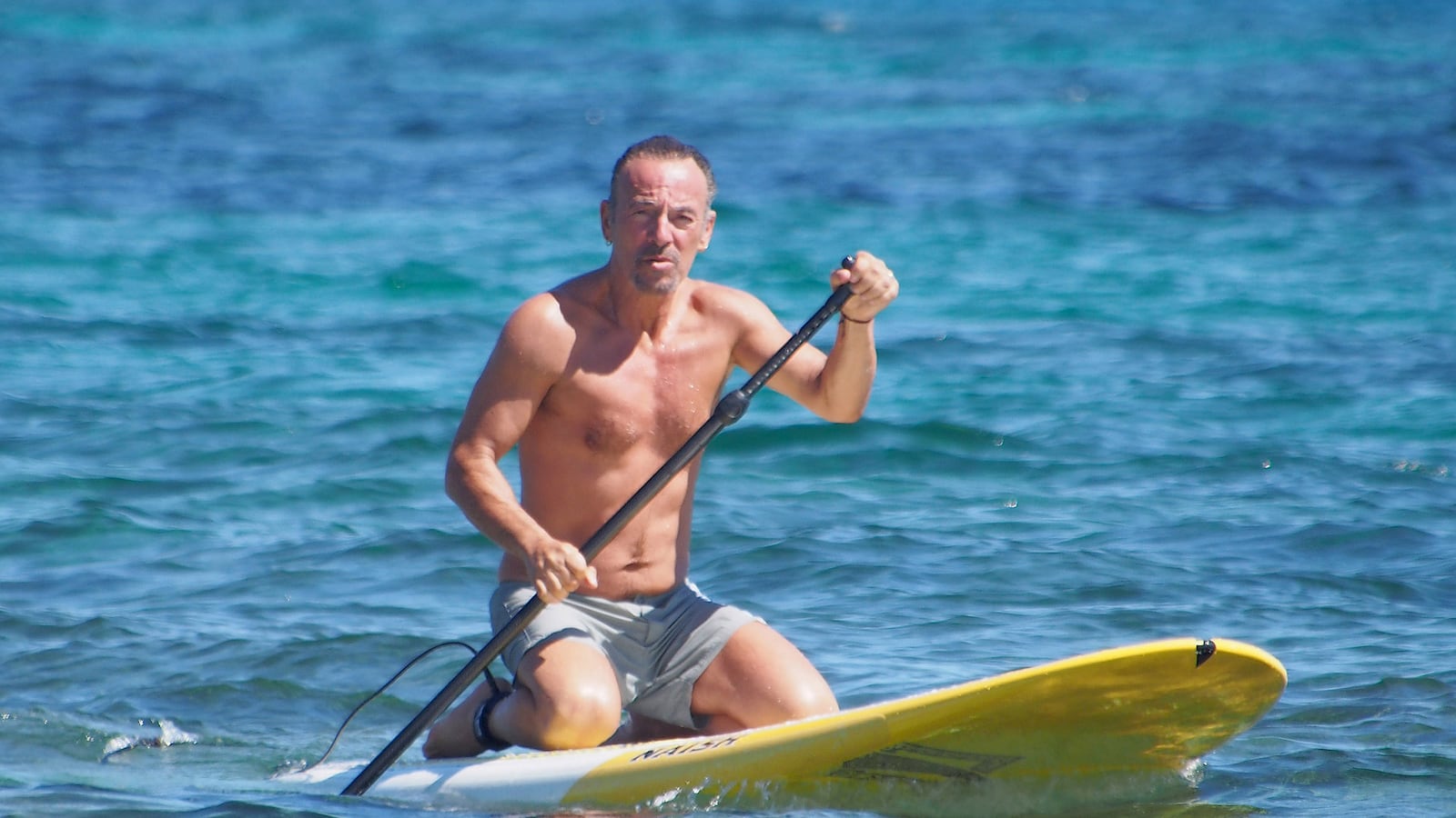 articles/2014/07/24/bruce-springsteen-s-bond-moment-the-boss-body-beautiful-at-64/1401724-teeman-bruce-tease_crwb7p