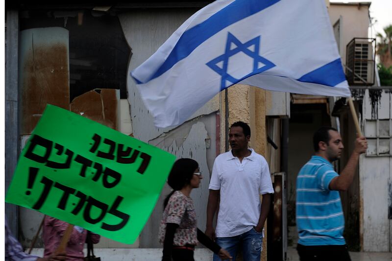 articles/2012/06/12/migrant-mitzvahs/sudanese-return-protest-openz_pj8dgu