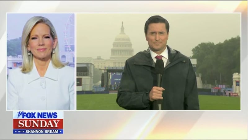 A live cross from one end of the National Mall to the other highlights the terrible weather and sparse attendance.