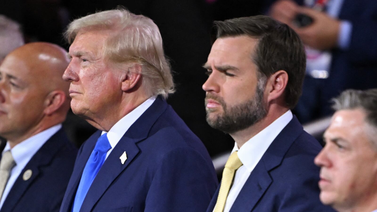 Former US President and 2024 Republican presidential candidate Donald Trump (3L) stands next to US Senator from Ohio and 2024 Republican vice presidential candidate J.D. Vance (3R) during the second day of the 2024 Republican National Convention at the Fiserv Forum in Milwaukee, Wisconsin, July 16, 2024. Days after he survived an assassination attempt Donald Trump won formal nomination as the Republican presidential candidate and picked right-wing loyalist J.D. Vance for running mate, kicking off a triumphalist party convention in the wake of last weekend's failed assassination attempt. (Photo by ANDREW CABALLERO-REYNOLDS / AFP) (Photo by ANDREW CABALLERO-REYNOLDS/AFP via Getty Images)