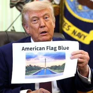President Donald Trump displays a rendering of his proposed renovations to the Lincoln Memorial Reflecting Pool during an event in the Oval Office of the White House on June 03, 2026 in Washington, DC. The landmark is being painted as part of President Trump's efforts to repair Washington D.C. in preparation for the Nation's 250th birthday.