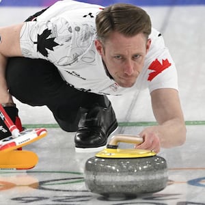 Canada's Marc Kennedy competes in the curling men's round robin between Switzerland and Canada during the Milano Cortina 2026 Winter Olympic Games at the Cortina Curling Olympic Stadium in Cortina d'Ampezzo on February 14, 2026. (Photo by Tiziana FABI / AFP via Getty Images)
