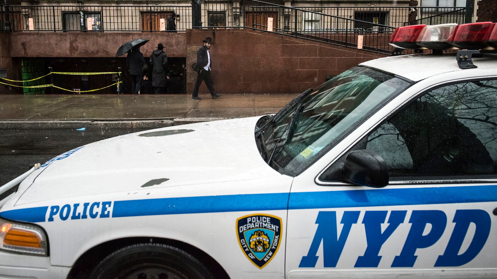 A police vehicle is seen outside the world headquarters of the Chabad-Lubavitch movement.