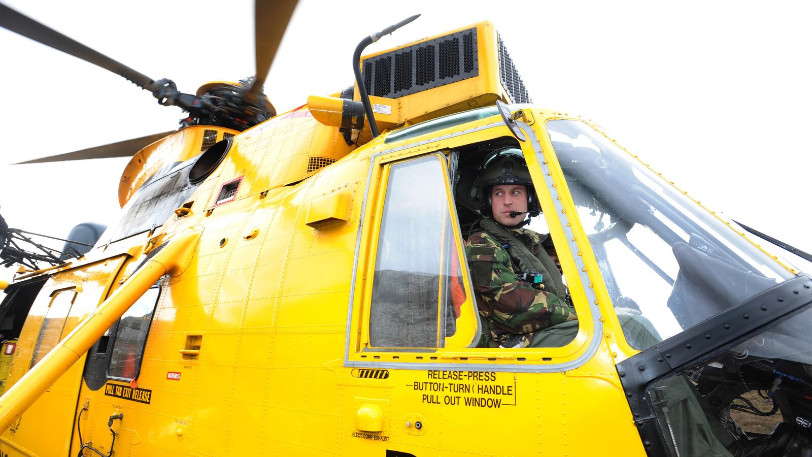 Prince William sits at the controls of a Sea King helicopter in 2011—the British defense ministry is being sued over claims some of its choppers exposed troops to toxic fumes which caused cancers.