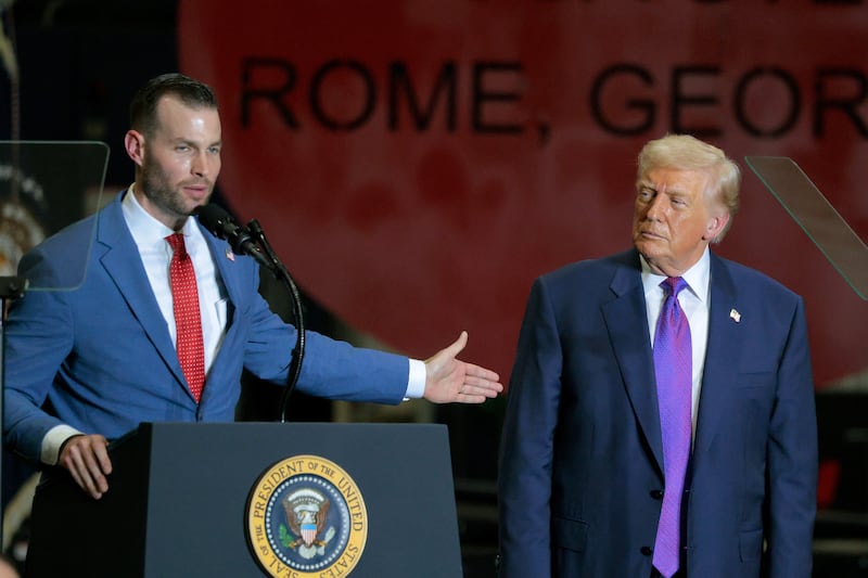 President Donald Trump looks on Republican congressional candidate Clay Fuller speaks at the Coosa Steel Corporation on February 19, 2026 in Rome, Georgia.