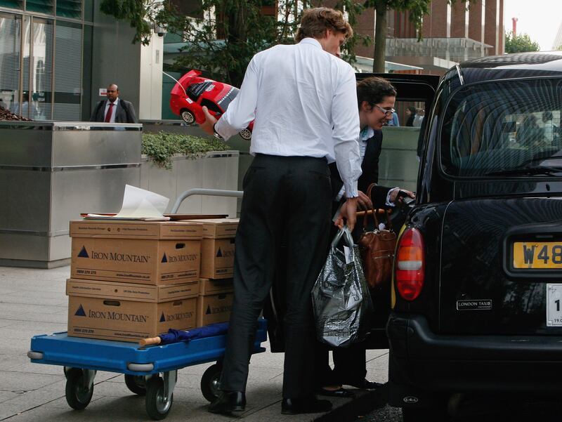 LONDON - SEPTEMBER 15: Employees leave Lehman Brothers' Canary Wharf office carrying belongings on September 15, 2008 in London, England. The fourth largest American investment bank has announced that it is filing for bankruptcy protection during a growing financial crisis. (Photo by Cate Gillon/Getty Images)