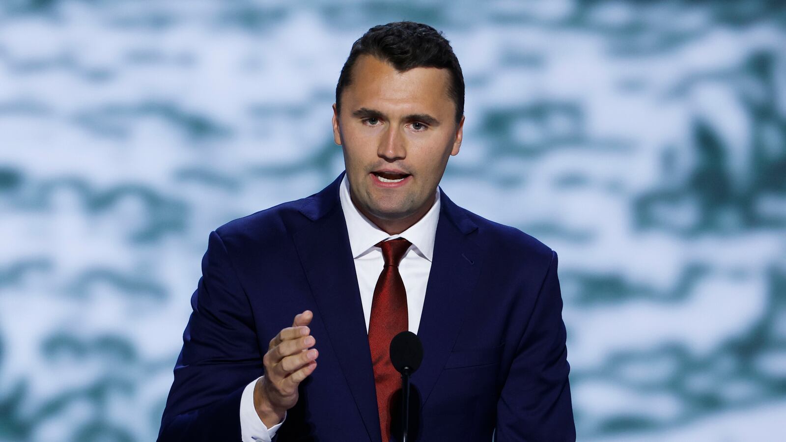 MILWAUKEE, WISCONSIN - JULY 15: CEO of Turning Point USA Charlie Kirk speaks on stage on the first day of the Republican National Convention at the Fiserv Forum on July 15, 2024 in Milwaukee, Wisconsin. Delegates, politicians, and the Republican faithful are in Milwaukee for the annual convention, concluding with former President Donald Trump accepting his party's presidential nomination. The RNC takes place from July 15-18. (Photo by Chip Somodevilla/Getty Images)