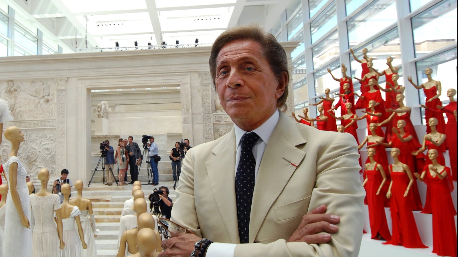 ITALY - JULY 06: Italian fashion designer Valentino celebrates 45 years of activity :exhibition at the Ara Pacis Museum in Rome. Rome rolled out the red carpet to welcome back Valentino Garavani, decking out a historic museum with his sweeping gowns. "I am filled with emotion," Valentino said at the opening of his retrospective in the modern, marble-and-glass venue designed by the American architect Richard Meier.The exhibit, set up by Patrick Kinmonth and Antonio Monfreda, includes more than 200 outfits, as well as shoes and accessories. One room is lined with dresses worn by famous clients, each accompanied by a video showing when and how the dress was worn.Valentino Garavani in Rome, Italy on July 06, 2007