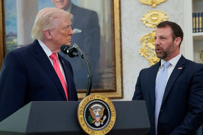Markwayne Mullin stands next to U.S. President Donald Trump as he attends his swearing-in as Department of Homeland Security (DHS) Secretary, at the White House in Washington, D.C., U.S., March 24, 2026. REUTERS/Evan Vucci