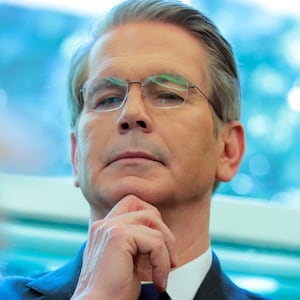 WASHINGTON, DC - APRIL 09: U.S. Treasury Secretary Scott Bessent looks on as U.S. President Donald Trump signs executive orders in the Oval Office of the White House on April 09, 2025 in Washington, DC. President Trump signed several executive orders including directing the “repeal of unlawful regulations” and reducing “anti-competitive regulatory barriers.” Earlier today, Trump announced a 90-day pause on the full effect of his new tariffs for dozens of countries with the exception of China. (Photo by Anna Moneymaker/Getty Images)