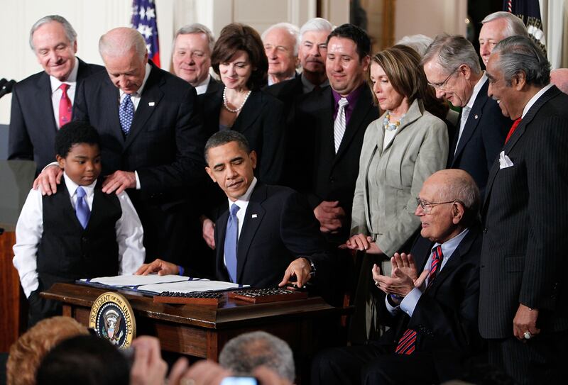 President Barack Obama signs the Affordable Health Care for America Act during a ceremony in the East Room of the White House March 23, 2010 in Washington, D.C. The historic bill was passed by the House of Representatives without a single Republican vote after a 14-month-long political battle.