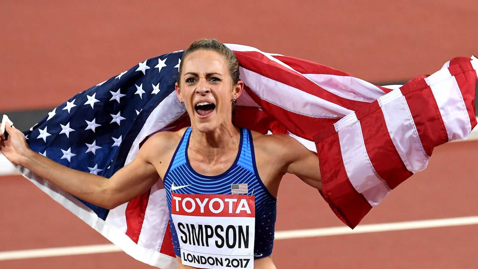 LONDON, ENGLAND - AUGUST 07: Jennifer Simpson of the United States, silver, celebrates with the US flag after the Women's 1500 metres final during day four of the 16th IAAF World Athletics Championships London 2017 at The London Stadium on August 7, 2017 in London, United Kingdom. (Photo by David Ramos/Getty Images)