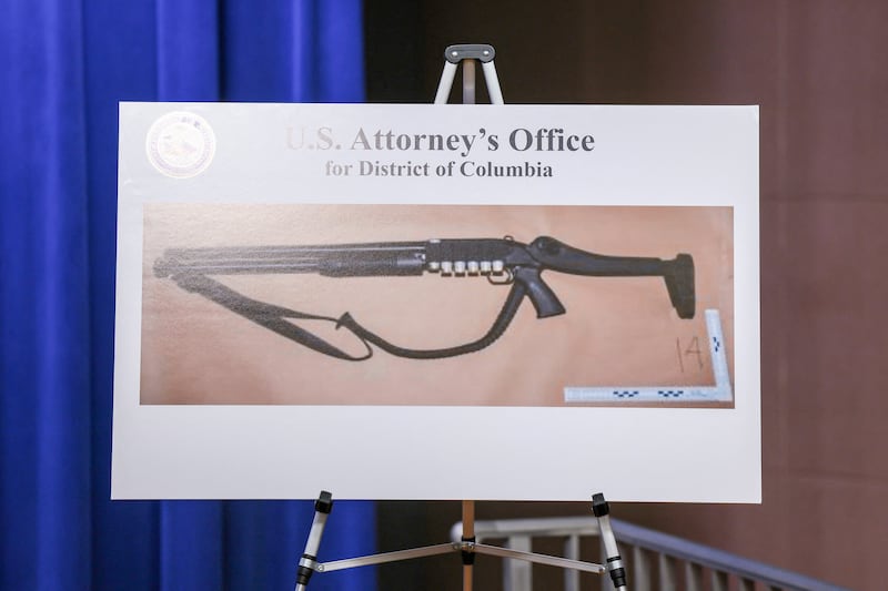 A picture of a shotgun carried by Cole Tomas Allen, the suspect in the shooting incident in Washington at the annual White House Correspondents' Association dinner, is displayed during a press conference at the U.S. Department of Justice about the shooting incident, in Washington, D.C., on April 27, 2026.