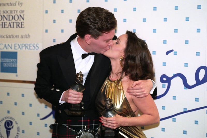 RUTHIE HENSHALL AND JOHN GORDON SINCLAIR CELEBRATE WITH A KISS AFTER SCOOPING BEST ACTOR AND ACTRESS IN A MUSICAL AT THE LAURENCE OLIVIER AWARDS. THE MUSICAL, SHE LOVES ME, RECEIVED FIVE ACCOLADES AT THE CEREMONY. (Photo by Louisa Buller - PA Images/PA Images via Getty Images)