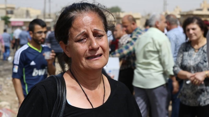 articles/2015/07/07/burying-christians-under-isis-guns/150705-wolf-iraq-corpses-embed_drpw25