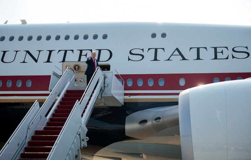 U.S. President Donald Trump gestures as he boards the new Air Force One, a plane gifted by the Qatari government, at Joint Base Andrews, Maryland, U.S., July 1, 2026. REUTERS/Evan Vucci       TPX IMAGES OF THE DAY