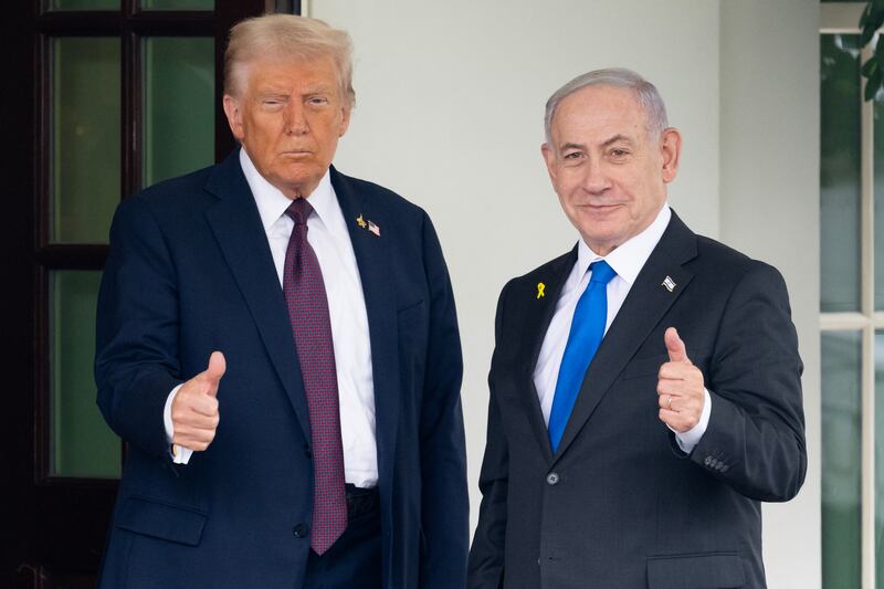 TOPSHOT - US President Donald Trump greets Israeli Prime Minister Benjamin Netanyahu as he arrives at the West Wing of the White House in Washington, DC on September 29, 2025. US President Donald Trump will push Israeli Prime Minister Benjamin Netanyahu to agree to an elusive Gaza peace plan on Monday in high-stakes talks at the White House. (Photo by SAUL LOEB / AFP) (Photo by SAUL LOEB/AFP via Getty Images)