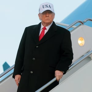JOINT BASE ANDREWS, MARYLAND - JANUARY 13: U.S. President Donald Trump walks down the air stairs after landing on Air Force One on January 13, 2026 at Joint Base Andrews, Maryland. Trump spent the day in Detroit participating in a tour of the Ford River Rouge complex and speaking at the Detroit Economic Club.  (Photo by Anna Moneymaker/Getty Images)