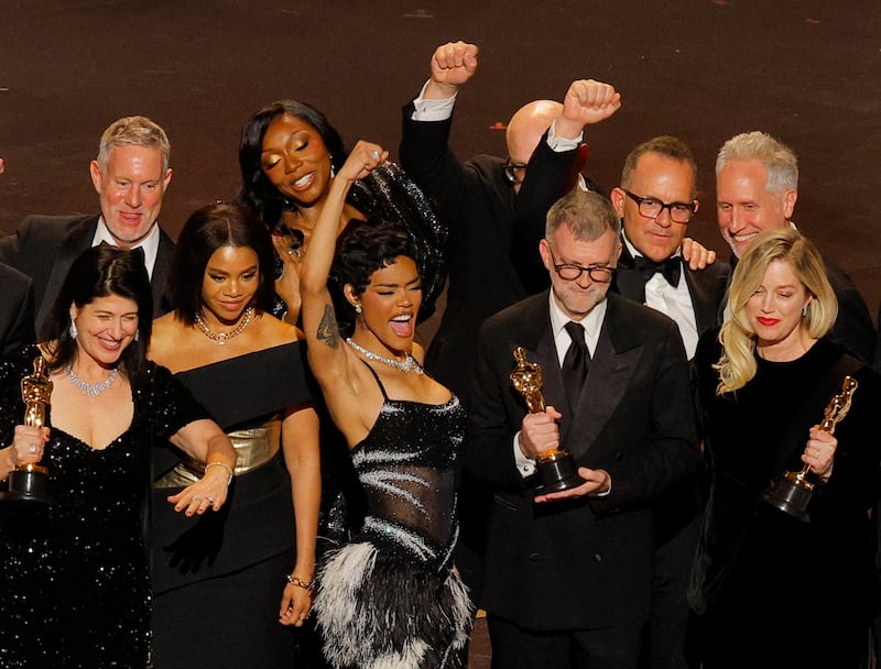 Director Paul Thomas Anderson, Sara Murphy and cast members celebrate after winning the Oscar for Best Picture for "One Battle after Another" during the Oscars show at the 98th Academy Awards in Hollywood, Los Angeles, California, U.S., March 15, 2026. REUTERS/Mike Blake