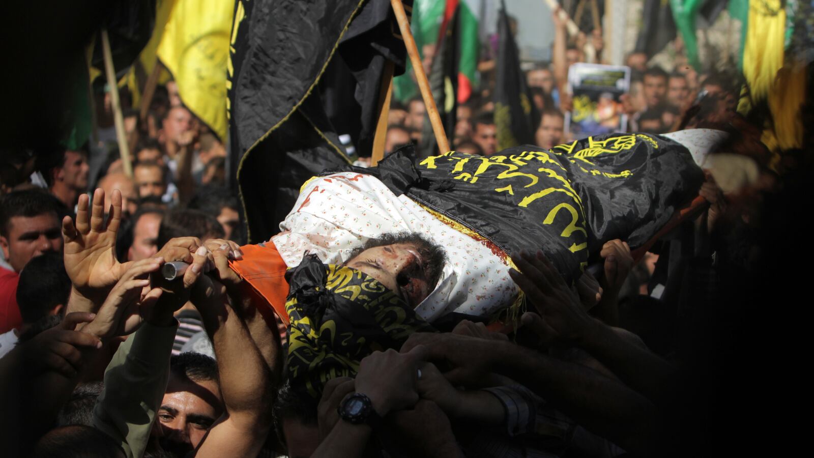 articles/2013/10/30/at-west-bank-funeral-palestinians-express-rising-support-for-armed-resistance/mohammed-assi-openz_whlpr4