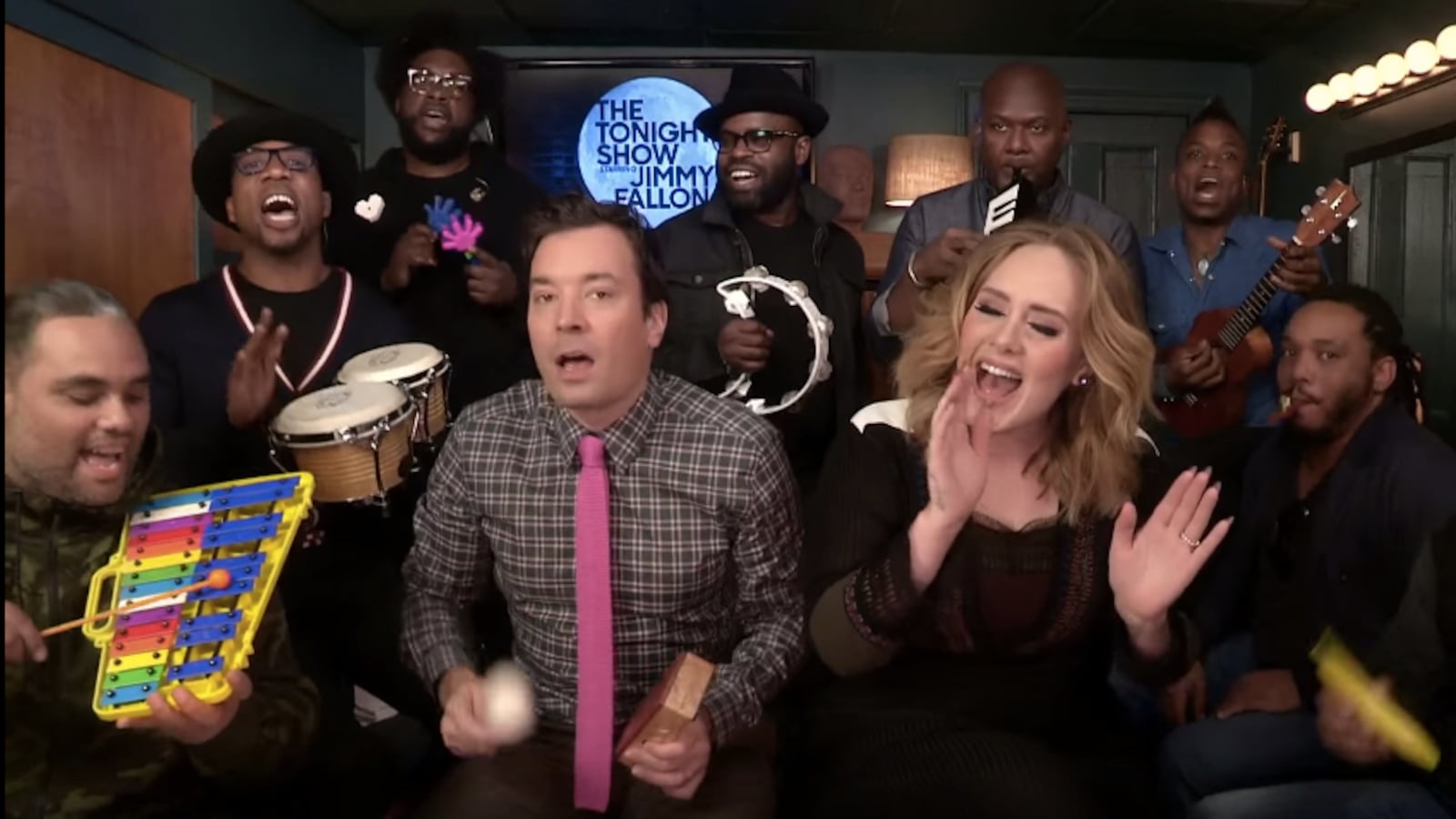 articles/2015/11/25/adele-and-jimmy-fallon-perform-hello-with-classroom-instruments/151124-wilstein-adele-fallon-tease_rye7nr