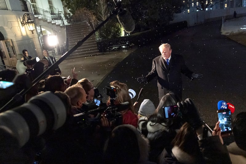 Trump speaks to reporters before boarding Marine One on the South Lawn of the White House on Friday. He has said he would donate any winnings to charity, but hasn't said which ones.