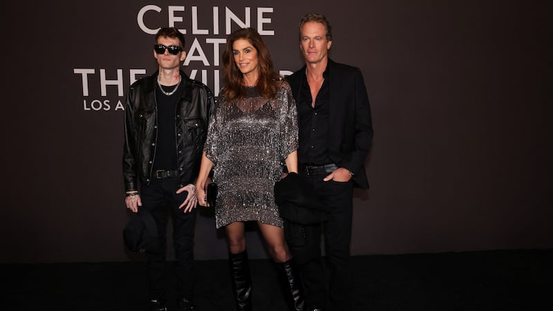 Supermodel Cindy Crawford and businessman Rande Gerber attend the Celine Fall Winter 2023 Fashion show with son Presley Gerber.