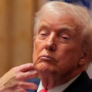 WASHINGTON, DC - DECEMBER 02: U.S. President Donald Trump looks on during a meeting of his Cabinet in the Cabinet Room of the White House on December 02, 2025 in Washington, DC. A bipartisan Congressional investigation has begun regarding Secretary of War Pete Hegseth's role in ordering U.S. military strikes on small boats in the waters off Venezuela that have killed scores of people, which Hegseth said are intended "to stop lethal drugs, destroy narco-boats and kill the narco-terrorists who are poisoning the American people.” (Photo by Chip Somodevilla/Getty Images)