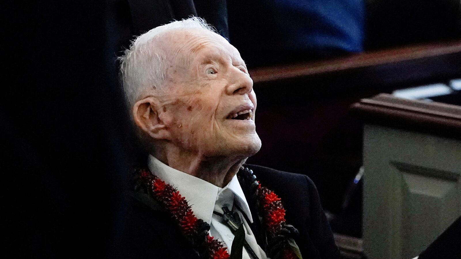 Jimmy Carter leaves the funeral service of his wife.