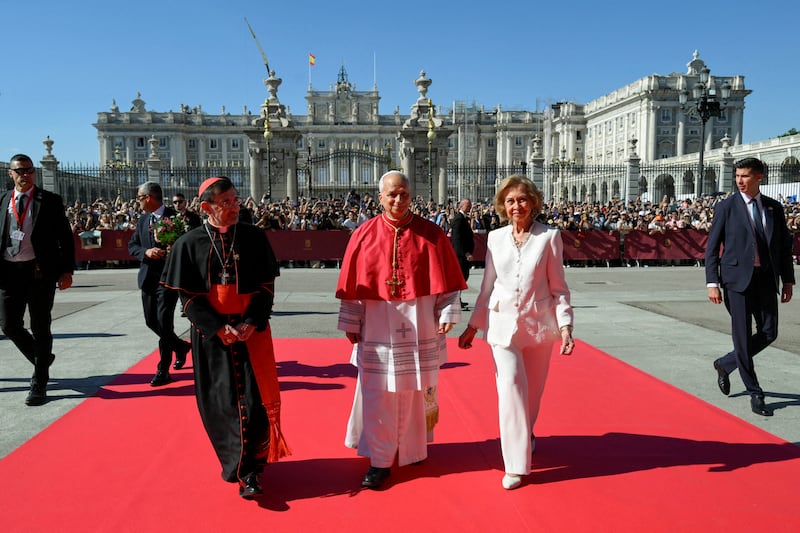 Pope Leo XIV, Spain's former Queen Sofia and Archbishop of Madrid Cardinal Jose Cobo Cano, walk as they visit the Almudena Cathedral in Madrid, Spain, June 8, 2026. Simone Risoluti/Vatican Media/Handout via REUTERS ATTENTION EDITORS - THIS IMAGE WAS PROVIDED BY A THIRD PARTY.