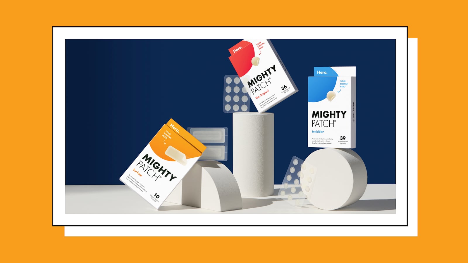 A collection of Hero Cosmetics' Mighty Patch boxes on a dark blue background.