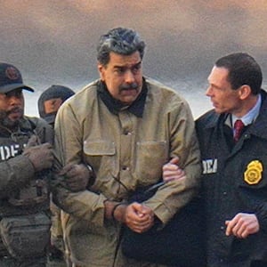 Nicolas Maduro is seen in handcuffs after landing at a Manhattan helipad