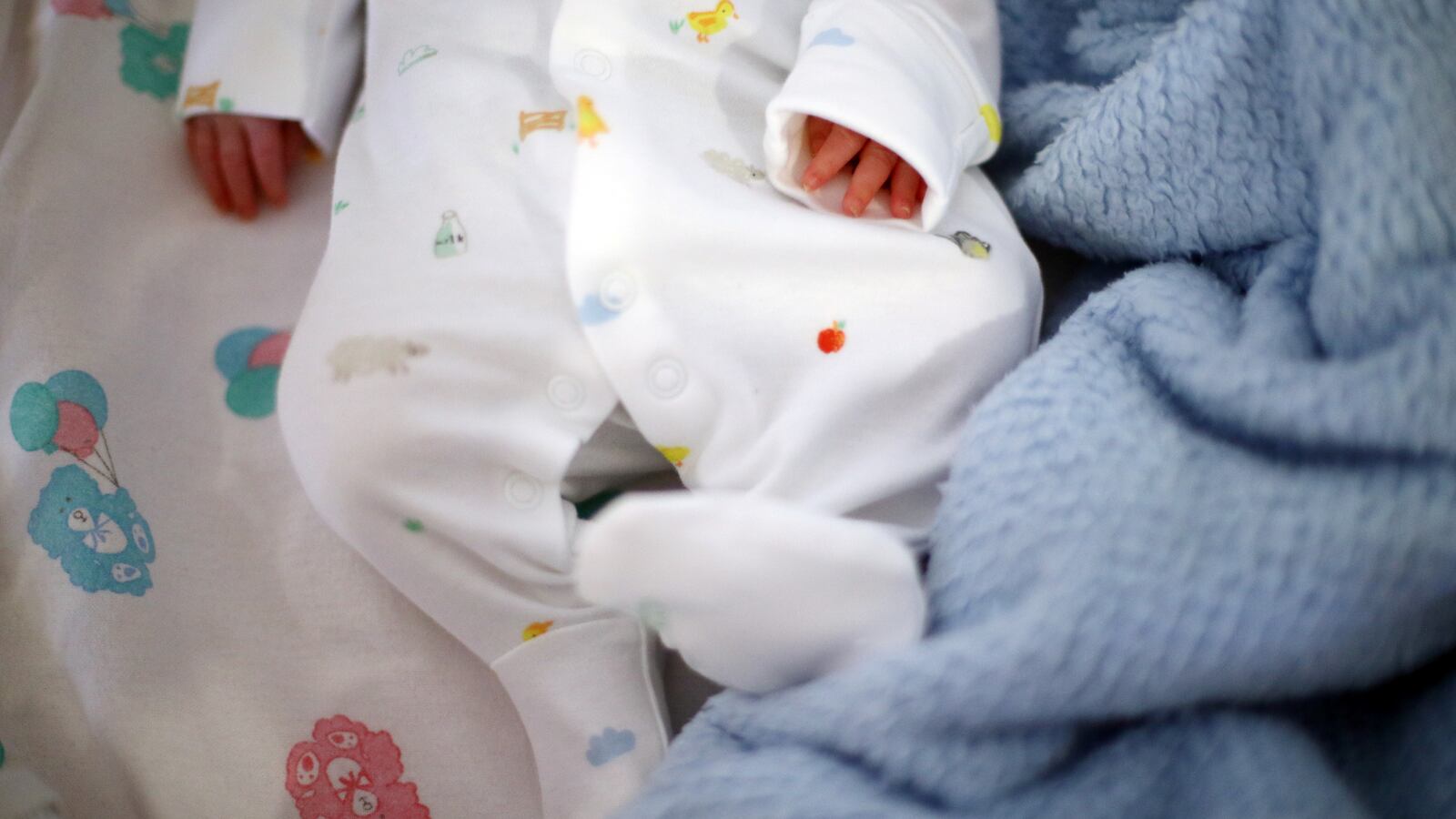 A baby before his release from the hospital in Britain, 2020.