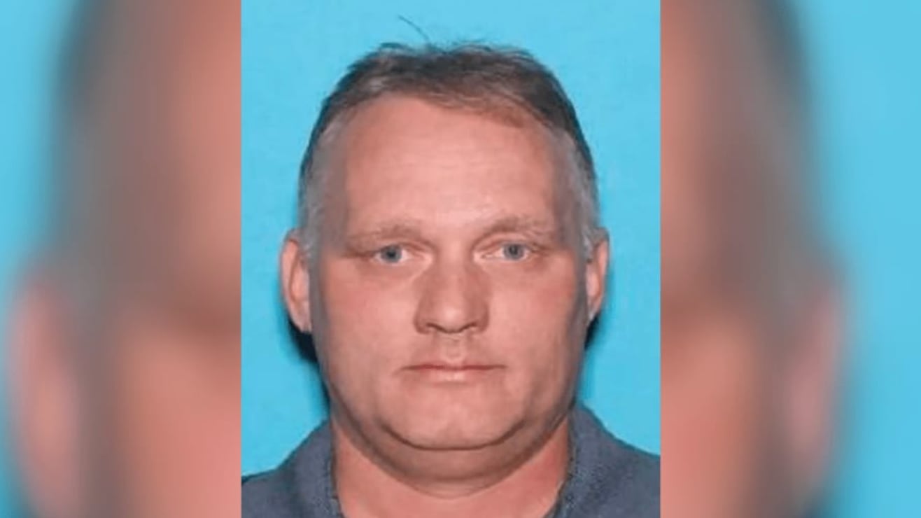Mugshot of Robert Bowers staring forward with a blue background.