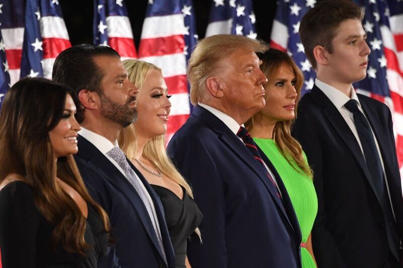 Barron Trump, US First Lady Melania Trump, US President Donald Trump, Tiffany Trump, Donald Trump Jr. and Kimberly Guilfoyle stand onstage at the conclusion of the final day of the Republican National Convention from the South Lawn of the White House on August 27, 2020 in Washington, DC.