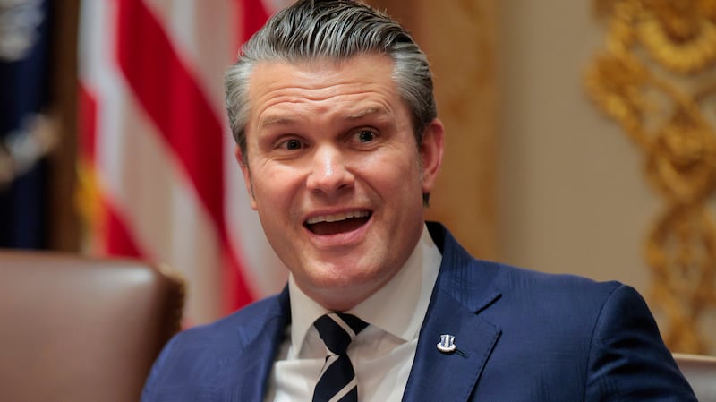 U.S. Secretary of War Pete Hegseth (R) speaks alongside U.S. President Donald Trump during a Cabinet meeting in the Cabinet Room of the White House on March 26, 2026 in Washington, DC.