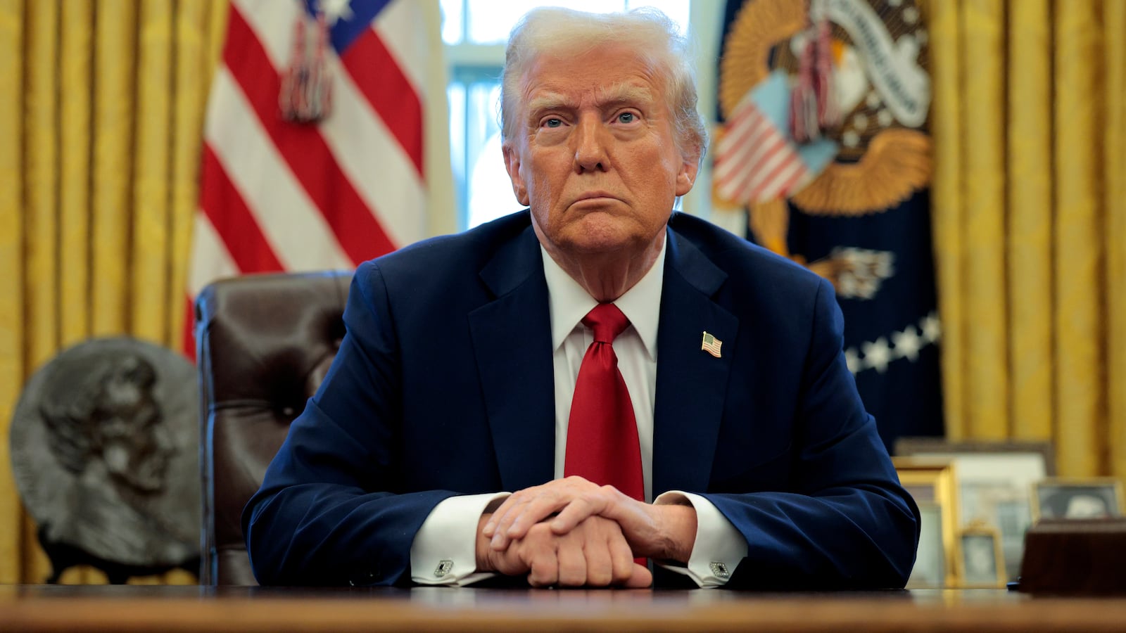 WASHINGTON, DC - JANUARY 30: U.S. President Donald Trump talks to reporters from the Resolute Desk after signing an executive order to appoint the deputy administrator of the Federal Aviation Administration in the Oval Office at the White House on January 30, 2025 in Washington, DC. Trump also signed a memorandum ordering an immediate assessment of aviation safety and ordering an elevation of what he called “competence” over “D.E.I.” (Photo by Chip Somodevilla/Getty Images)