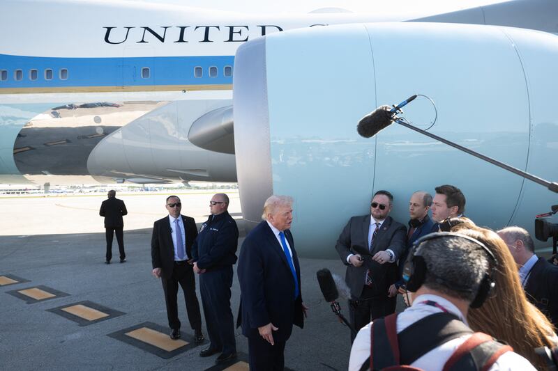 US President Donald Trump speaks to reporters before boarding Air Force One at Palm Beach International Airport in West Palm Beach, Florida, on March 23, 2026. President Donald Trump said Monday that there are "major points of agreement" in US-Iran talks which he said must result in Tehran giving up its nuclear ambitions and enriched uranium stockpile. Trump said the talks -- which Iran denies are taking place -- were being conducted with a "top person" but not the country's supreme leader. (Photo by SAUL LOEB / AFP via Getty Images)