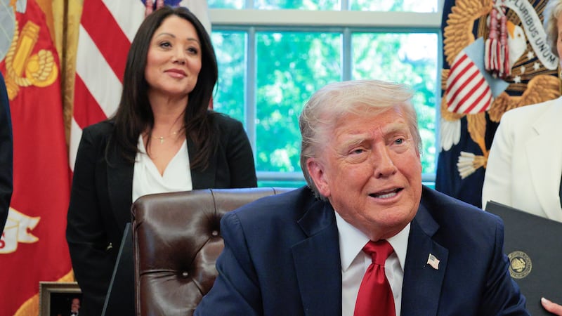 President Donald Trump speaks to the media as Secretary of Labor Lori Chavez-DeRemer look on after signing executive orders in the Oval Office at the White House on April 23, 2025 in Washington, DC.