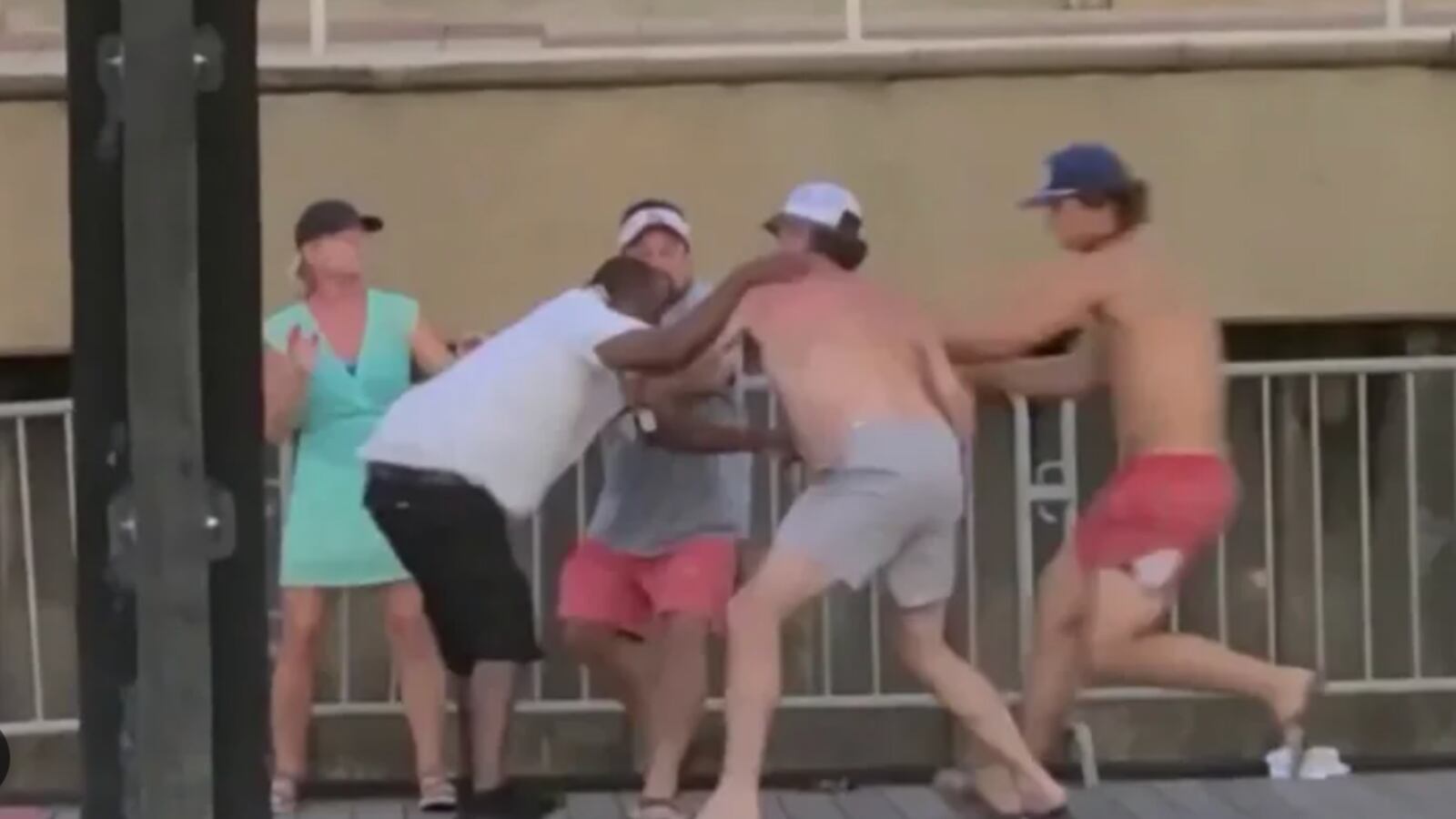 Three white men jump a Black man on a boat deck in Montgomery, Alabama.