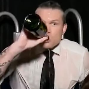Pete Hegseth drinks champagne in a dunk tank during a Fox News 2023 New Year's segment.